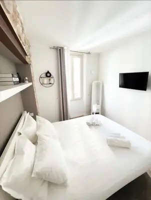 a living room with a couch and a table at Casa Dolce Cannes in Cannes