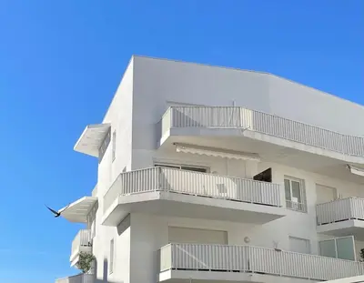 a white building with balconies on the side of it at Cannes Maria in Cannes