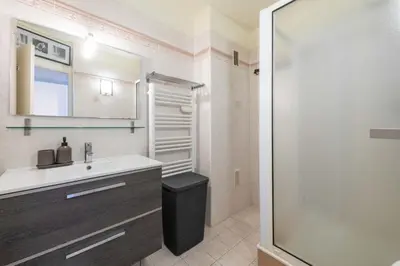 a bathroom with a sink and a toilet and a shower at 1-Br Apartment Palm Beach Near Beaches & La Croisette in Cannes