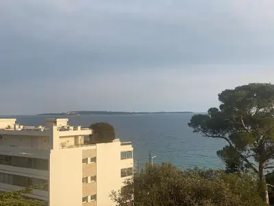 a building with a view of the water at Primavera in Cannes