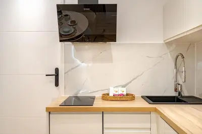a kitchen with a sink and a counter top at Élégant 2P Rue Meynadier Proche du Palais et des plages in Cannes