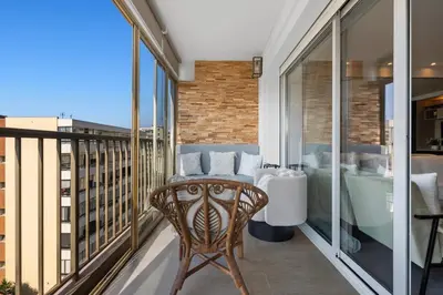 a balcony with a tub and a bed and a chair at 11 MADRID - Splendid one-bedroom apartment near Croisette in Cannes