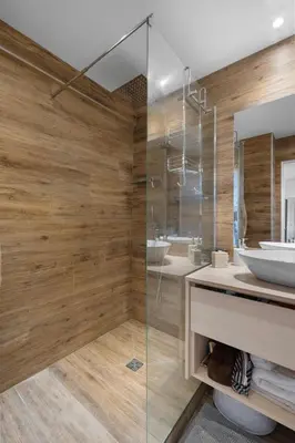 a bathroom with a glass shower and a sink at 11 MADRID - Splendid one-bedroom apartment near Croisette in Cannes