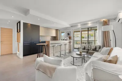 a living room and kitchen with white furniture at 11 MADRID - Splendid one-bedroom apartment near Croisette in Cannes