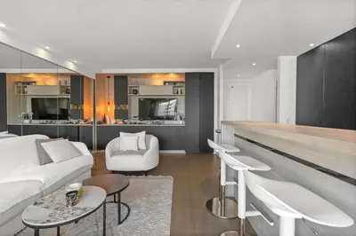 a living room with a white couch and a kitchen at 11 MADRID - Splendid one-bedroom apartment near Croisette in Cannes