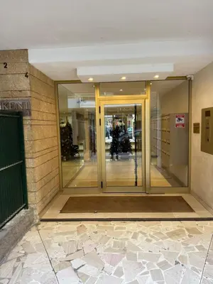 an entrance to a building with revolving glass doors at Carlton Exclusive - Elégant T2 au coeur de la Croisette in Cannes