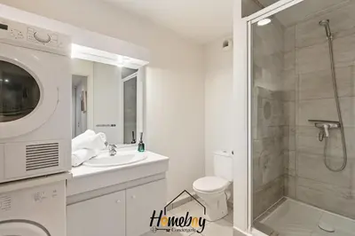 a bathroom with a shower and a toilet and a sink at Le Palazzio in Cannes
