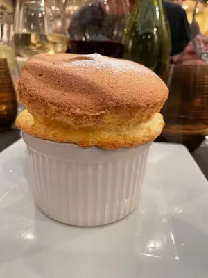 a cupcake sitting on top of a white plate at Perfect location in Cannes