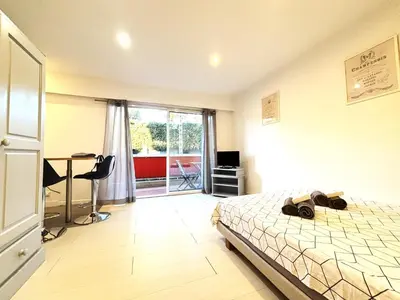 a bedroom with a bed and a desk and a table at Ideal Congress MIPIM terrace calm 1 kms from Palais in Cannes