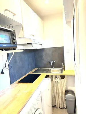 a small kitchen with a sink and a microwave at Ideal Congress MIPIM terrace calm 1 kms from Palais in Cannes