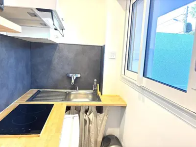 a kitchen with a sink and a window at Ideal Congress MIPIM terrace calm 1 kms from Palais in Cannes