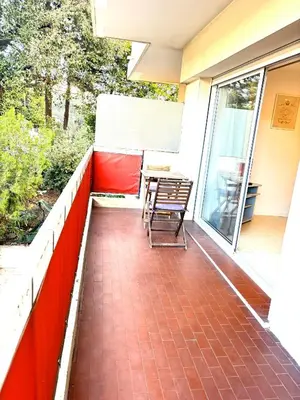 a patio with a table and chairs on a balcony at Ideal Congress MIPIM terrace calm 1 kms from Palais in Cannes