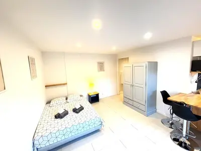 a small room with a bed and a desk at Ideal Congress MIPIM terrace calm 1 kms from Palais in Cannes