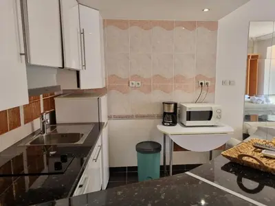 a kitchen with a sink and a microwave on a counter at Charming Studio near Croisette in Cannes