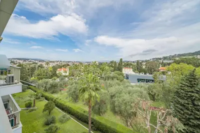 an aerial view of a city with trees and buildings at COZYSTAY 1700 -Luxury 3-Bedroom Apartment with Terrace & Sea View in Cannes in Cannes
