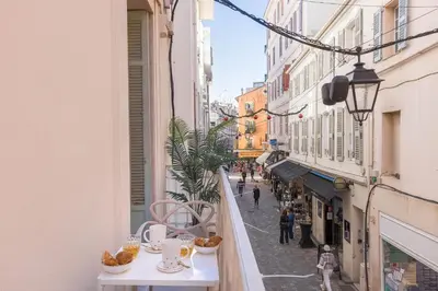 a view of a street from a balcony of a building at Studio Méro by Halldis in Cannes