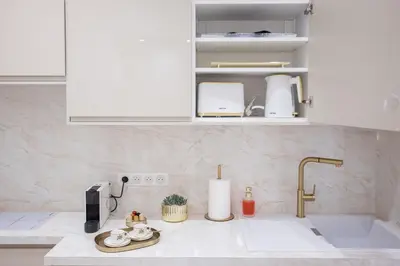a kitchen with a sink and a counter top with a sink at Studio Méro by Halldis in Cannes