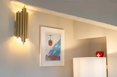 a room with a white refrigerator and a picture on the wall at Elegant renovated studio on the top floor Cannes city center in Cannes