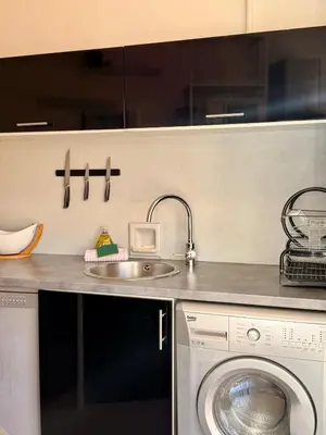 a kitchen with a sink and a washing machine at Le Marvel By ApiRent #Climatisation #Central #Balcon in Cannes