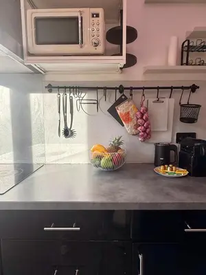 a kitchen with a counter with a microwave and fruit at Le Marvel By ApiRent #Climatisation #Central #Balcon in Cannes