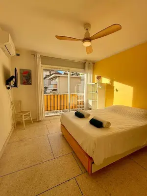 a bedroom with a bed and a ceiling fan at Le Marvel By ApiRent #Climatisation #Central #Balcon in Cannes