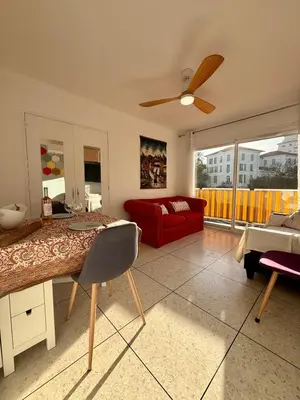 a living room with a red couch and a red chair at Le Marvel By ApiRent #Climatisation #Central #Balcon in Cannes