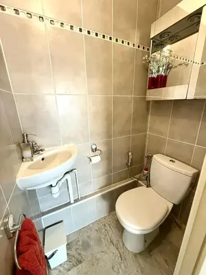 a bathroom with a toilet and a sink at T2 derrière le Martinez - Croisette in Cannes