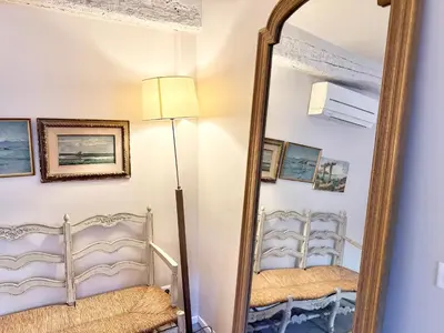 a mirror in a room with two beds at Elegant studio in Cannes - Le Suquet - 2 people in Cannes