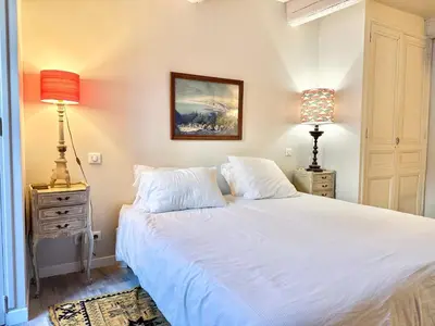 a bedroom with a white bed and two lamps at Elegant studio in Cannes - Le Suquet - 2 people in Cannes