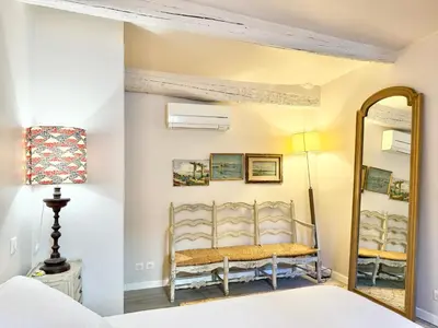 a bedroom with a mirror and a bed at Elegant studio in Cannes - Le Suquet - 2 people in Cannes