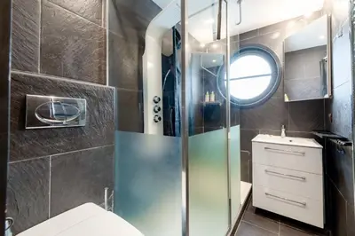 a bathroom with a shower and a toilet and a sink at 1-Br Apartment in Cannes Peaceful Seaside Atmosphere in Cannes