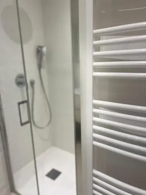 a bathroom with a shower with a glass door at Armenonvillecannes in Cannes