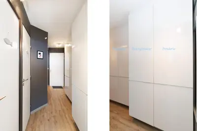 a hallway with white wardrobes and white cabinets at Vue mer piscine parking tennis 4 personnes in Cannes