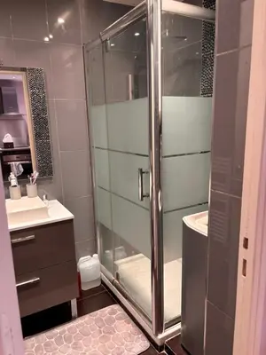 a bathroom with a shower and a toilet and a sink at Studio Palais Rouaze-50m de la Croisette in Cannes