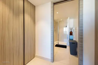 a bathroom with a toilet and a glass door at Villa Lerins 405 by Halldis in Cannes
