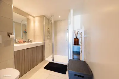 a bathroom with a shower and a toilet and a sink at Villa Lerins 405 by Halldis in Cannes