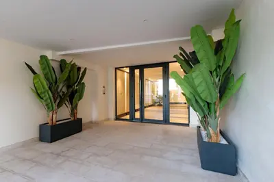 two potted plants sitting on a wall in a room at Villa Lerins 401 by Halldis in Cannes