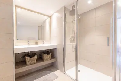 a bathroom with a sink and a shower at Villa Lerins 401 by Halldis in Cannes