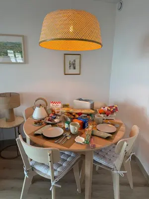 a dining room table with food on top of it at CasaMia Cannes - Exceptional Sea View, Pool, Beach in Cannes