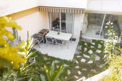 an overhead view of a patio with a table and chairs at Private Garden Hideaway by the Sea in Cannes