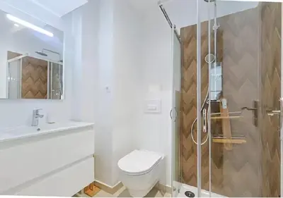 a bathroom with a shower and a toilet and a sink at Magnifique 2 pièces au Suquet in Cannes