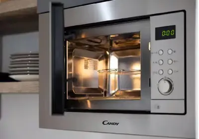 a microwave oven with a pan inside of it at Magnifique 2 pièces au Suquet in Cannes