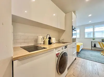 a kitchen with a washing machine and a sink at Cannes One bedroom Apartment - M10 in Cannes