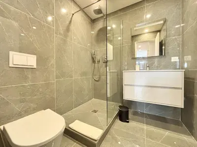 a bathroom with a toilet and a glass shower at Cannes One bedroom Apartment - M10 in Cannes