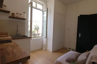 a kitchen with a sink and a large window at Pearl Studio by Halldis in Cannes
