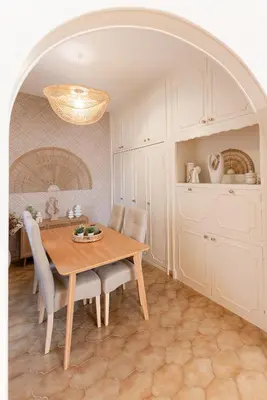 a dining room with a wooden table and chairs at Écrin de charme à 2 pas de la Croisette & Palais in Cannes