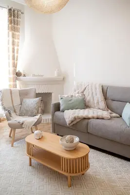 a living room with a couch and a coffee table at Écrin de charme à 2 pas de la Croisette & Palais in Cannes