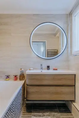 a bathroom with a sink and a mirror at Quiet Beach Cannes in Cannes