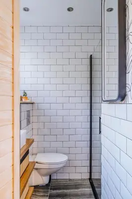 a white bathroom with a toilet and a shower at Quiet Beach Cannes in Cannes