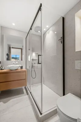a bathroom with a shower and a toilet and a sink at REF 2030 - Cannes Croisette - Sea view apartment for rent in Cannes